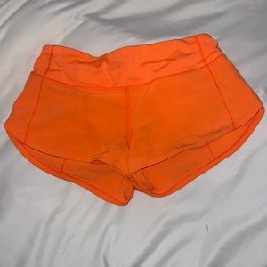 lululemon speed-up shorts, size 4 (2.5”) neon orange